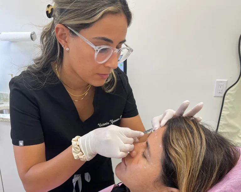 A Contour Aesthetics injector treating a patient's brow area in the treatment chair