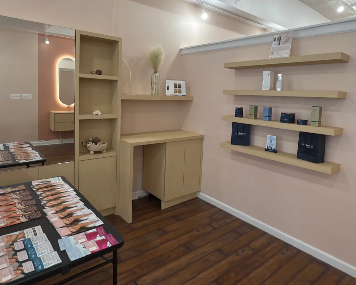 The Contour Aesthetics studio in Greenpoint, Brooklyn: welcome desk, lit mirror and product shelves