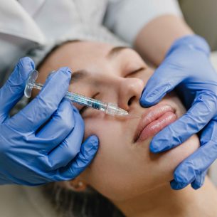 closeup-portrait-young-woman-doing-botox-procedures-by-professional-injection-making-lips-modern-devices-technology-medicine-cosmetology-therapy_11zon